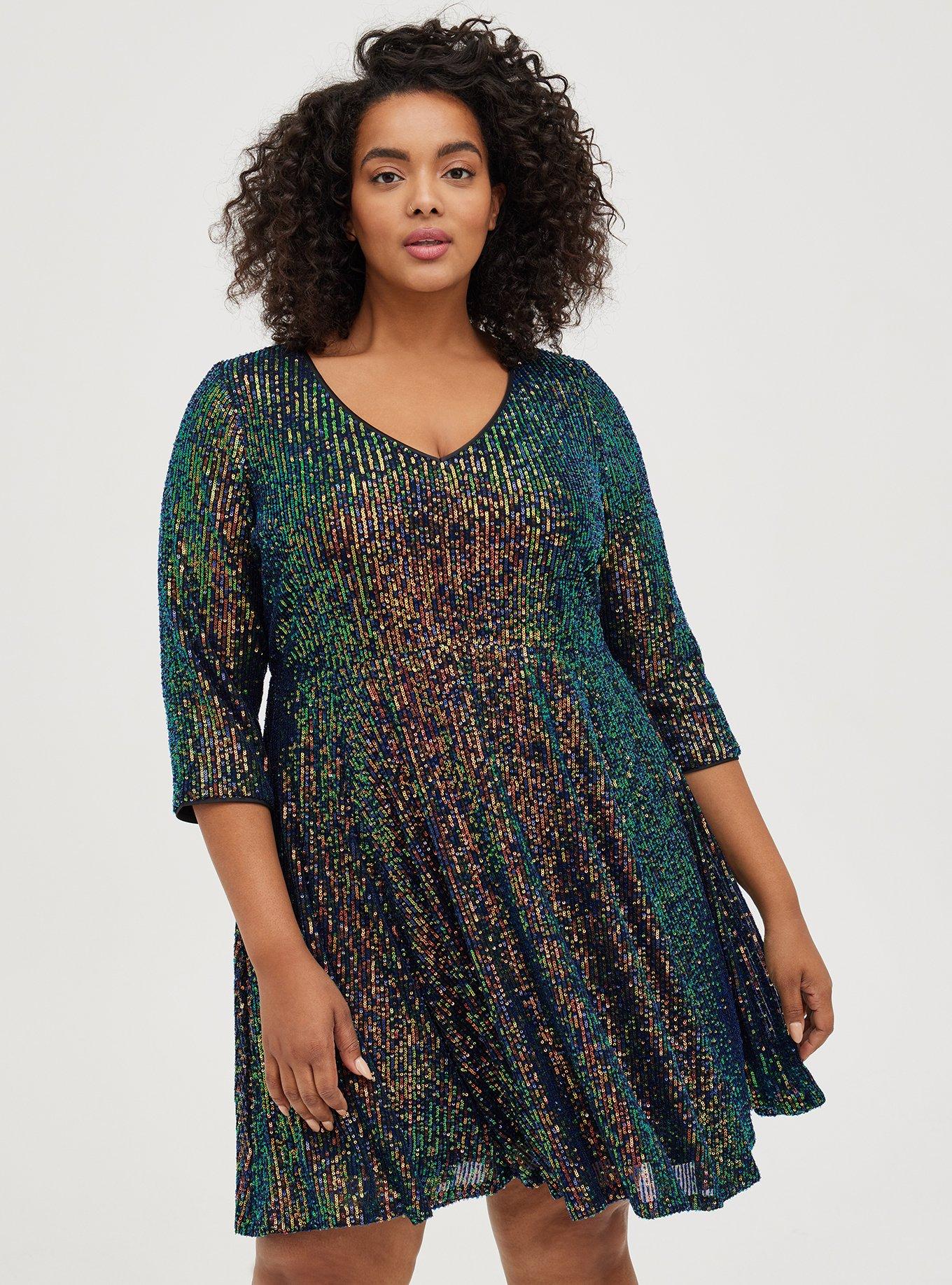 How to Layer Your Party Dresses: a plus size holiday outfit featuring a  colorful sequin dress from Lane Bryant styled with a long sleeved tee and  tights.