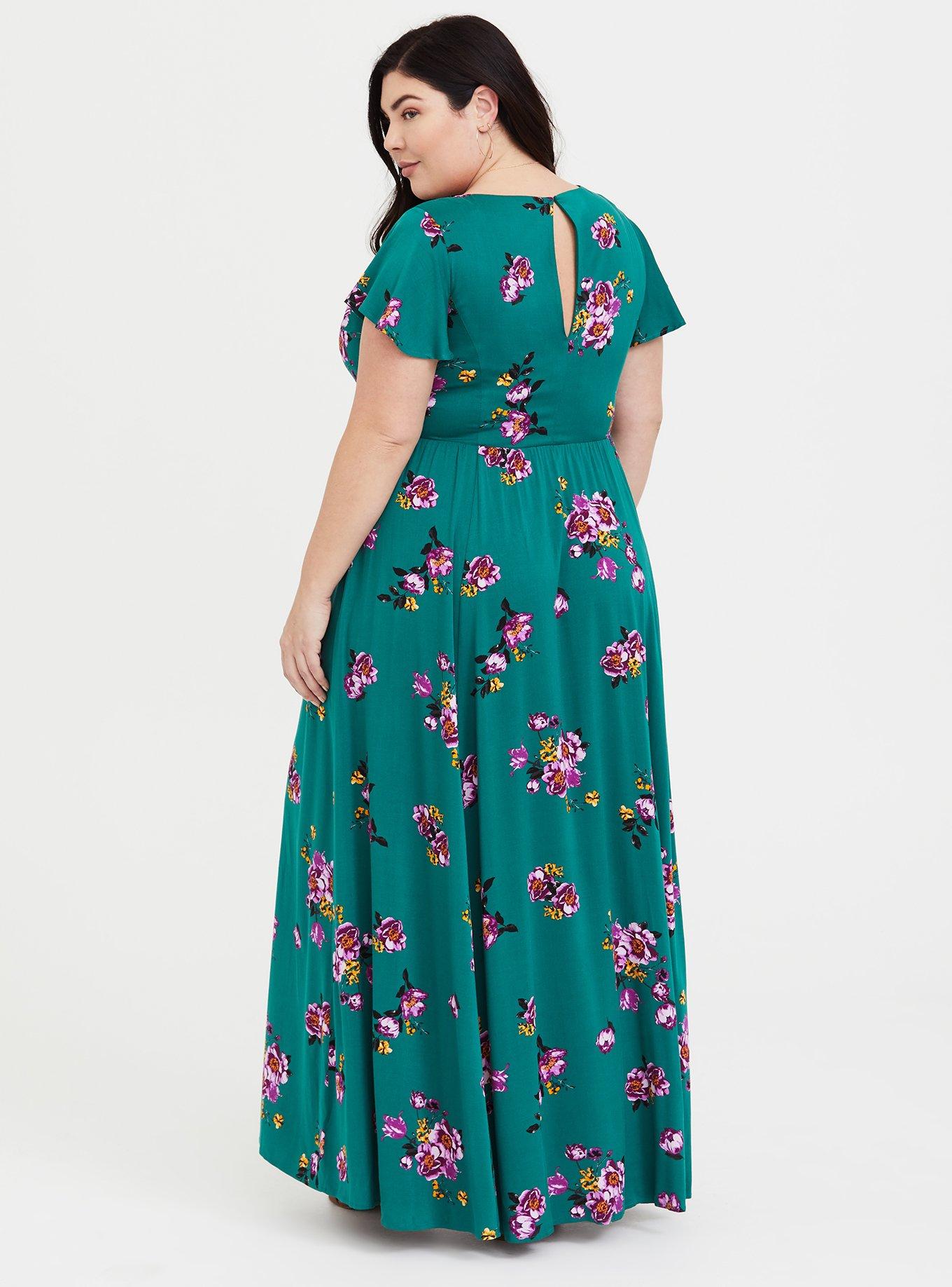 Green Floral Dress: a plus size summer outfit featuring a green floral dress  and wide fit straw hat from Torrid, and a dark green Kate Spade handbag.