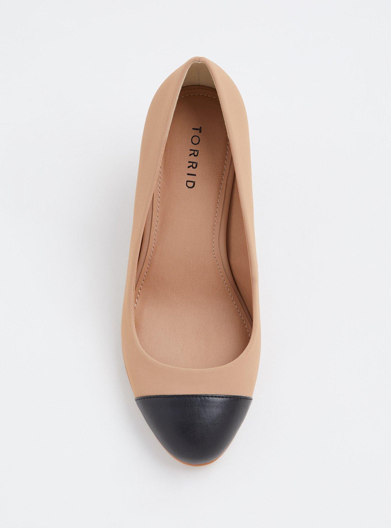 Black and shop tan pumps