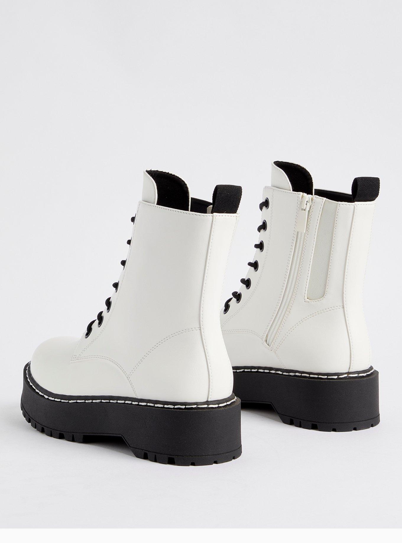 White boots shop with black laces