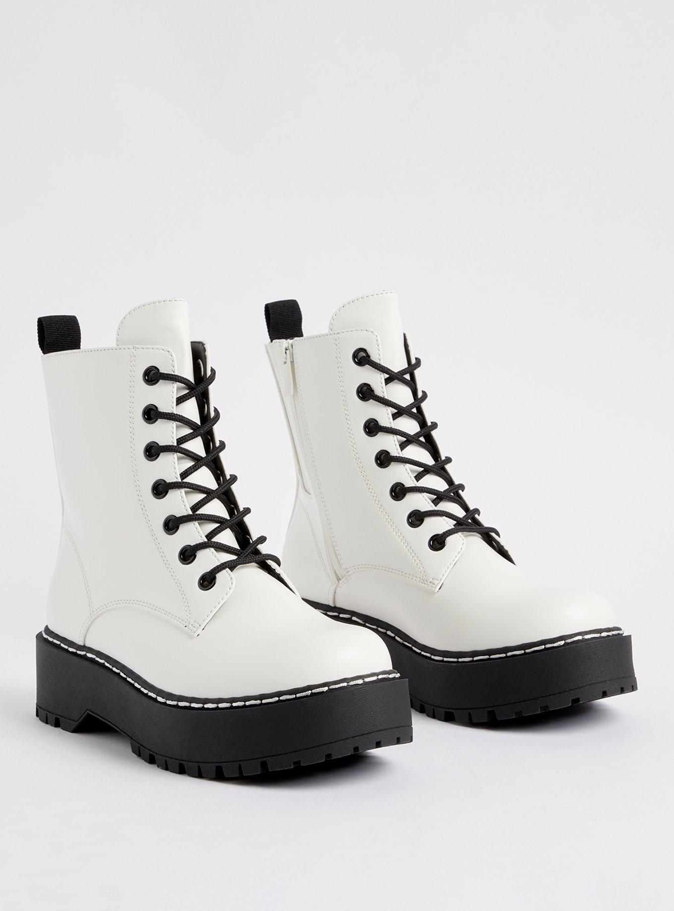 White and black store combat boots