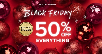 Red holiday-themed background with decorative ornaments surrounding the text 'Black Friday 40% Off Everything*' in bold white font. The phrase 'In Store + Online' is displayed above the main text.