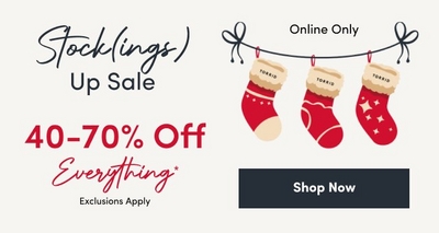 Holiday-themed banner for the 'Stock(ings) Up Sale' featuring three red stockings with white tops labeled 'TORRID,' hanging on a string. Text highlights '40-70% Off Everything' with exclusions applied. The sale is online only, with a 'Shop Now' button included.