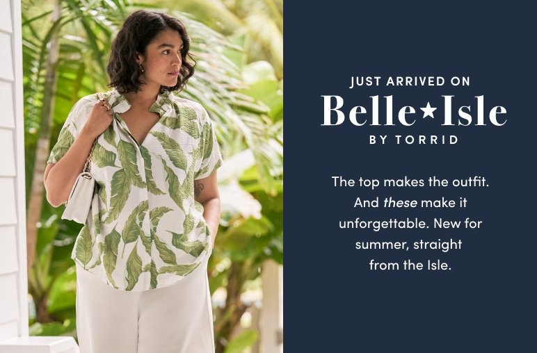 Smiling woman standing on a dock by the ocean wearing a white dress with blue floral prints and holding a straw hat. Text reads Just arrived on Belle Isle by Torrid. New dresses for your favorite season. So pretty. So airy. Made for sun
