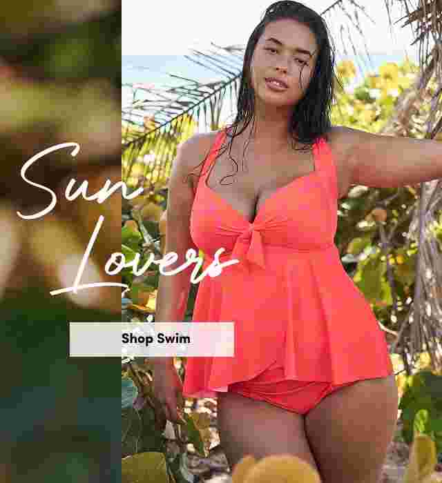 Woman wearing a bright coral swim set with a bow-front top, posing in tropical beach scenery with greenery and ocean in the background. Text reads Sun Lovers and Shop Swim