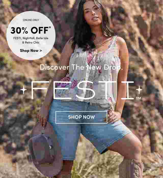 Woman standing confidently in front of rocky cliffs wearing a floral embroidered tank top, denim shorts, and holding a cowboy hat. Text reads Discover the New Drop FESTI with a Shop Now button.