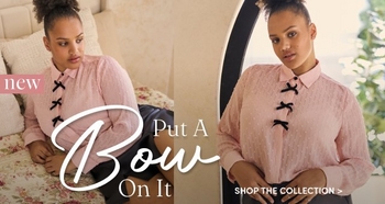 A model wears a light pink blouse with three black bow accents, shown sitting on a floral bedspread and standing near a window. Text reads “New. Put a Bow on It.” A call to action says “Shop the Collection.”