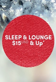 'Red circular badge with a woven fabric-like textured surface and white centered text that reads SLEEP & LOUNGE $15 USD & Up*, set against a softly blurred background of icy white snow and frosted pine branches.'