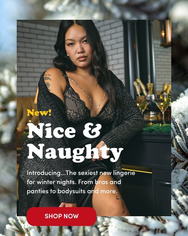 'Woman seated beside a bar decorated with greenery and glasses of champagne, wearing a black lace bra with a plunging neckline, a silky black skirt, and a sparkly knit cardigan draped off her shoulders. The background includes white subway tile and warm lighting. Overlaid text in yellow and white reads New! Nice & Naughty Introducing...The sexiest new lingerie for winter nights. From bras and panties to bodysuits and more. At the bottom is a red rectangular button with white text that reads SHOP NOW. Frosted pine needles frame the top and bottom edges of the image.'