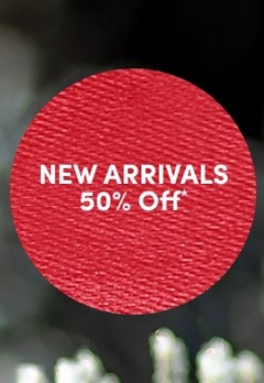 'Red circular badge with a visible fabric-like textured surface and white centered text that reads NEW ARRIVALS 50% Off*, set against a softly blurred dark green and gray background with hints of white highlights.'