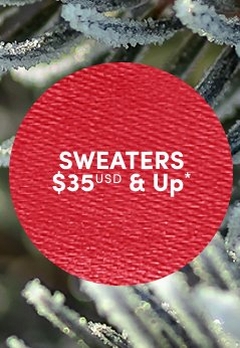 'Red circular badge with a woven fabric-like textured surface and white centered text that reads SWEATERS $35 USD & Up*, set against a softly blurred background of green pine needles dusted with frost and snow.'
