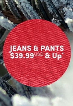 'Red circular badge with a fabric-like textured surface and white centered text that reads JEANS & PANTS $39.99 USD & Up*, placed over a softly blurred background of frosted pine branches with patches of snow.'