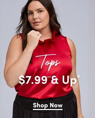 A close-up photograph of a light-skinned model with long brunette hair wearing a vibrant red satin sleeveless top with a ruffled collar. She is posing with one hand raised to her chin against a plain grey background. White text is overlaid on the center of the image reading 'Tops' in a cursive script, and '$7.99 USD & Up*' in a large, bold sans-serif font. A small white underlined 'Shop Now' link is centered at the bottom.