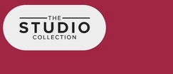 A horizontal banner with a deep pink to burgundy gradient background. On the left side, a white rounded rectangular pill-shaped button or badge contains black text arranged in three lines reading 'THE' (small, with decorative horizontal lines on either side), 'STUDIO' (large, bold letters), and 'COLLECTION' (small, in a condensed font).