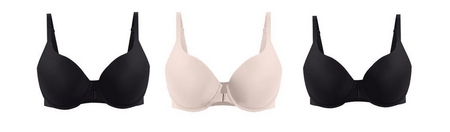 Three t-shirt bras displayed flat on a light gray background. From left to right: a black t-shirt bra with smooth molded cups and adjustable straps, a light pink t-shirt bra with smooth molded cups, a small gold-tone hardware detail at center gore, and adjustable straps, and a black t-shirt bra with smooth molded cups and adjustable straps.
