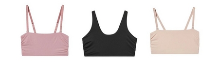 Three bralettes displayed flat on a white background. From left to right: a dusty mauve pink bandeau-style bralette with wide adjustable straps and ruched side detail, a black scoop-neck bralette with wide straps and smooth fabric, and a nude beige bandeau-style bralette with wide adjustable straps and ruched side detail.