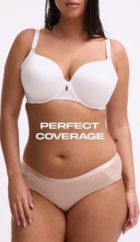 Model shown from chin to upper thigh against a light gray background, wearing a white t-shirt bra with molded cups, adjustable straps, and a small keyhole detail at center gore, paired with nude pink bikini panties with lace trim at the waistband. Model has long straight dark hair falling over one shoulder. White text overlay reads 'PERFECT COVERAGE' across the midsection.