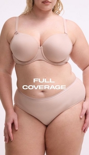 Model shown from chin to upper thigh against a light gray background, wearing a nude beige strapless bra with molded cups, side boning, and a sweetheart neckline, paired with matching nude beige high-waisted shaping briefs with a smooth waistband. Model has blonde wavy hair visible at shoulders. White text overlay reads 'FULL COVERAGE' across the midsection.