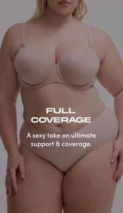 Model shown from chin to upper thigh against a light gray background, wearing a nude beige strapless bra with molded cups, side boning, and a sweetheart neckline, paired with matching nude beige high-waisted shaping briefs with a smooth waistband. Model has blonde wavy hair visible at shoulders. White text overlay reads 'FULL COVERAGE' with subtext below reading 'A sexy take on ultimate support & coverage.'