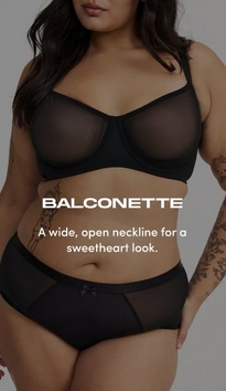 Model shown from chin to mid-thigh against a light gray background, wearing a black sheer mesh balconette bra with underwire and visible seaming, paired with black sheer mesh cheeky panties with a small bow at center front. Model has long dark wavy hair and a floral tattoo sleeve visible on left forearm. White text overlay reads 'BALCONETTE' with subtext below reading 'A wide, open neckline for a sweetheart look.'