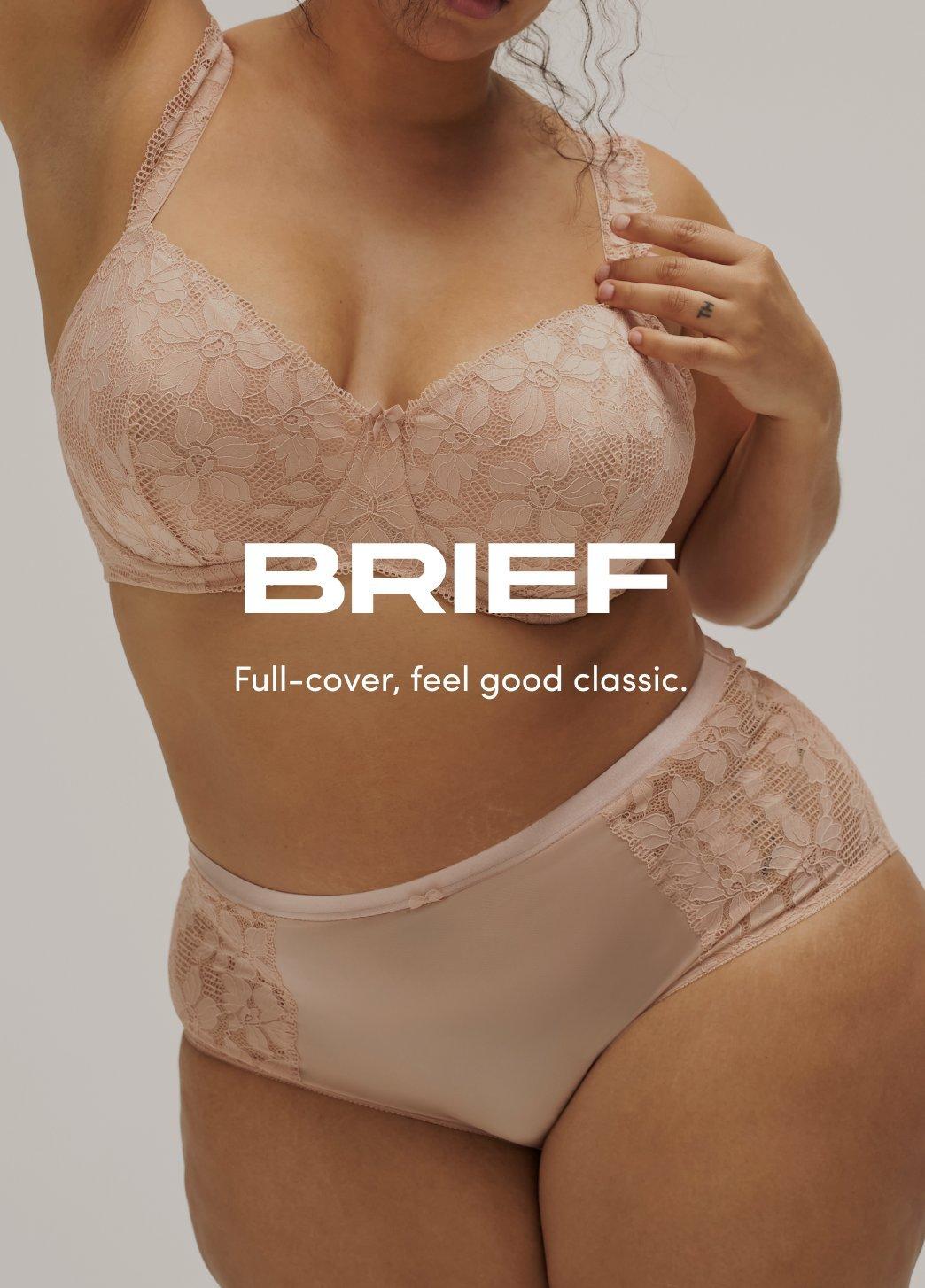 Model wearing a blush lace bra and matching brief underwear, shown from chest to upper thighs against a neutral background. On image text reads Brief. Full-cover, feel good classic.