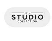 A logo on a white background featuring the text 'THE STUDIO COLLECTION' in black capital letters. The word 'STUDIO' is prominently displayed in large bold sans-serif font, while 'THE' appears smaller above it and 'COLLECTION' appears smaller below it, both with horizontal lines on either side. The entire text is contained within a light gray rounded rectangular pill-shaped background.