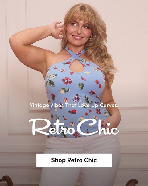 'A tall promotional banner with a soft blush pink paneled wall background and two upholstered chairs partially visible at the bottom. A plus-size model stands smiling with one hand raised near her ear and the other in her pocket. She wears a light blue fruit and floral print cross-neck halter top with a keyhole cutout and white pants, and has voluminous wavy blonde hair with bangs and gold hoop earrings. In the center in small white text reads New Just Bloomed. Below in large white script text reads Retro Chic, with smaller white text below reading Sexy-Sweet Spring Arrivals Are Waiting. At the bottom is a bold underlined white Shop Retro Chic link.'