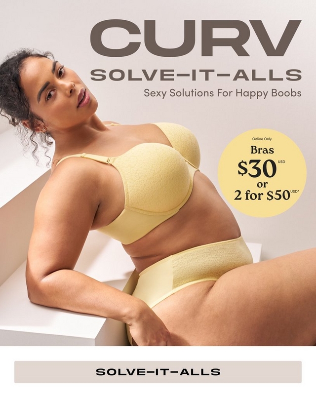 A promotional banner for 'Curv Solve-It-Alls' with the tagline 'Sexy Solutions For Happy Boobs' in dark brown text at the top against a light gray background. A woman with curly dark hair pulled up, small stud earrings, and a delicate necklace sits on a white geometric step or block, leaning back. She wears a pale yellow textured strapless bra with adjustable straps and matching pale yellow high-waist briefs. A light taupe rectangular button reading 'Solve-It-Alls' appears at the bottom of the image on a white background.'