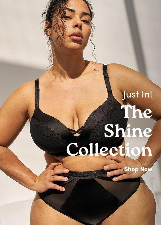 Model in a black satin-finish bra and mesh-panel panties. Text: Just In! The Shine Collection. Shop Now.