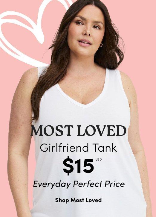 Model in a white V-neck Girlfriend Tank. Text: MOST LOVED Girlfriend Tank $15 USD Everyday Perfect Price. Shop Most Loved.