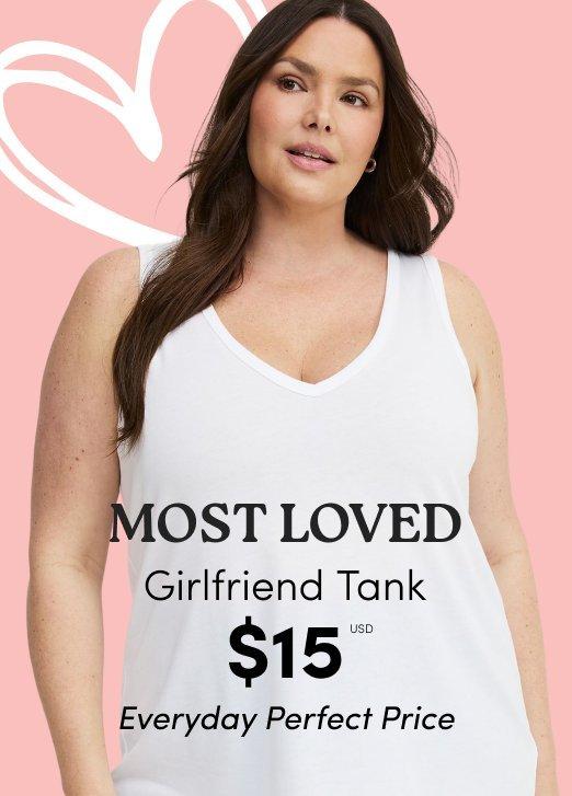 "Torrid advertisement: Model in a white V-neck Girlfriend Tank. Text: MOST LOVED Girlfriend Tank $15 USD Everyday Perfect Price. Shop Most Loved."