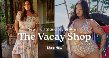 Two models showcasing summery 'Fruit Stand' styles. One model wears a white floral and citrus print two-piece set on a rustic porch, while the other wears a citrus print one-piece swimsuit in a sunny outdoor setting. Bold white text in the center reads: 'New Fruit Stand Styles Are In! The Vacay Shop Shop Now'.