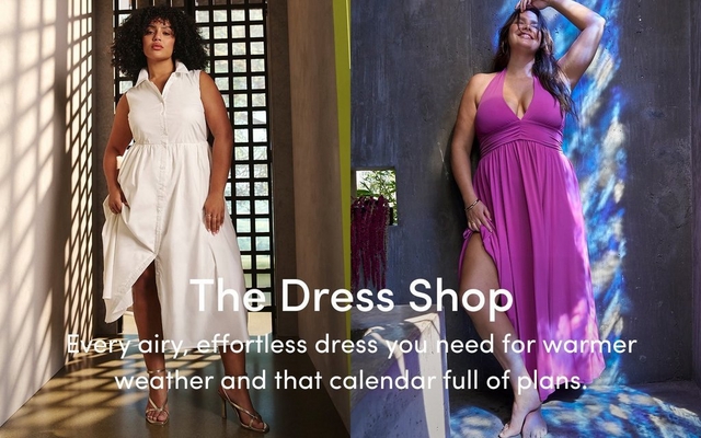 A promotional banner for 'The Dress Shop' with the tagline 'Every airy, effortless dress you need for warmer weather and that calendar full of plans.' in white text overlaid across two side-by-side photos. On the left, a woman with short curly dark hair stands in a sunlit tiled interior with a geometric lattice window casting shadows, wearing a white sleeveless button-front shirt dress with an asymmetric hem and gold strappy heeled sandals. On the right, a woman with long dark wavy hair and hoop earrings leans barefoot against a textured gray concrete wall with blue painted light effects and a small niche holding a hanging dried floral arrangement, smiling with one arm raised, wearing a bright magenta halter maxi dress with a V-neckline, ruched waist, and front slit.