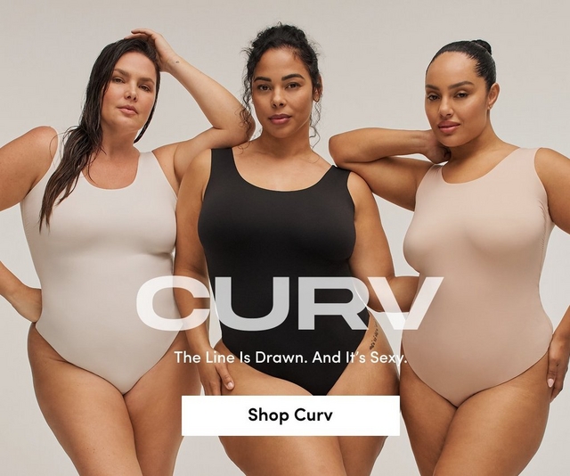 A promotional banner for 'Curv' with the tagline 'The Line Is Drawn. And It's Sexy.' and a white 'Shop Curv' button overlaid on a photo. Three women stand close together barefoot against a light gray background, each wearing a smooth seamless thong bodysuit. The woman on the left wears a light beige bodysuit with one hand raised to her head. The woman in the center wears a black bodysuit with one hand resting at her hip. The woman on the right wears a nude pink bodysuit with one arm raised behind her head.