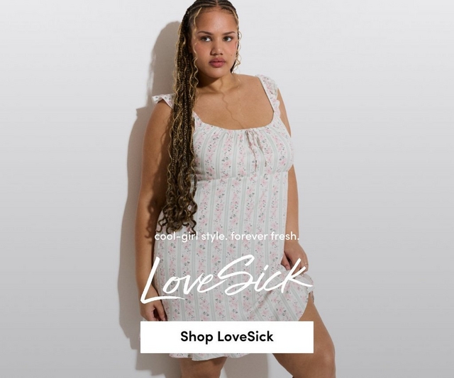 A promotional banner for 'LoveSick' with the tagline 'cool-girl style. forever fresh.' and a white 'Shop LoveSick' button overlaid on a photo. A woman with long box braids with blonde highlights and hoop earrings stands against a light gray background looking to the side. She wears a white sleeveless mini dress with ruffle shoulder straps, a gathered square neckline with tie detail, and an allover pink floral and green stripe print with ruffle hem.