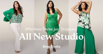 Three models showcasing the chic and professional 'Studio' collection against a neutral light-grey studio background. The model on the left wears a green leaf-patterned top paired with a solid green blazer and white trousers. The center model wears a vibrant green sleeveless draped dress. The model on the right wears a green and black floral one-shoulder top with wide-leg green trousers. Throughout the center, bold white text reads: 'Effortless Styles Just Dropped. All New Studio' with an underlined 'Shop Studio' link at the bottom.