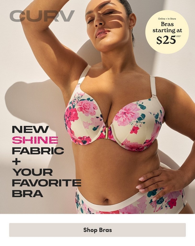 'Promotional banner for Torrid CURV on a light beige background with soft angular shadow shapes. A plus-size woman with medium skin tone and dark hair pulled back poses with one arm raised above her head and the other hand on her hip, eyes closed and face tilted upward. She is wearing a cream-colored bra and high-waist briefs with a pink, red, and teal floral print, and a gold front clasp detail on the bra. In the upper left corner, gray text reads 'CURV'. In the upper right corner is a pale yellow circle badge with dark text reading 'Online + In Store Bras starting at $25 USD' with an asterisk. On the lower left, bold dark text reads 'NEW' with 'SHINE' in bold pink on the next line, followed by 'FABRIC + YOUR FAVORITE BRA' in bold dark text on separate lines. At the bottom is a light gray rectangular button with bold dark text reading 'Shop Bras'.'