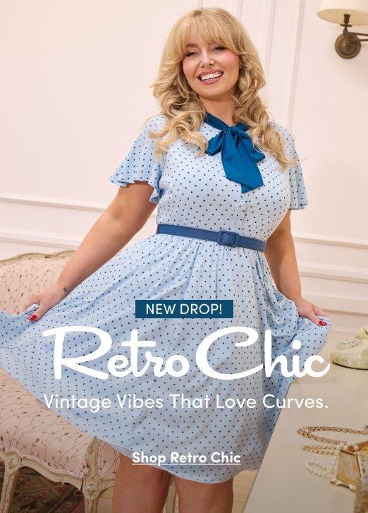 'Promotional banner for Torrid featuring Retro Chic, set in an elegant vintage-styled room with white paneled walls, a wall-mounted brass lamp, and a pink floral upholstered settee. A plus-size woman with light skin tone and long wavy blonde hair with bangs smiles broadly, holding out the skirt of her dress. She is wearing a light blue polka dot fit-and-flare midi dress with flutter sleeves, a teal satin bow at the collar, and a matching teal belt at the waist. A small dark teal rounded badge reads 'NEW DROP!' above large white cursive script text reading 'Retro Chic' with smaller white text below reading 'Vintage Vibes That Love Curves.' Below that, bold dark underlined text reads 'Shop Retro Chic'.'