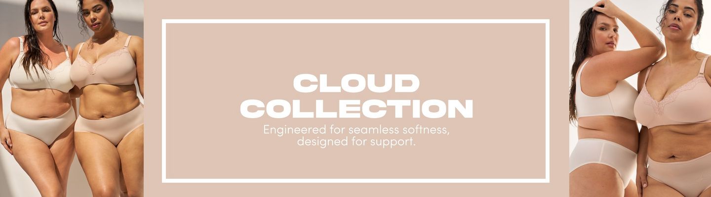 'A wide promotional banner for the Cloud Collection featuring four plus-size models against a warm sandy beige background. On the left, two women with long dark wet hair stand close together outdoors. The first wears a cream wireless bra with lace trim and matching high-waist briefs, and the second wears a nude smooth full-coverage bra with adjustable straps and matching seamless briefs. In the center, a light taupe rectangle contains bold white text reading 'CLOUD COLLECTION' with smaller white text below reading 'Engineered for seamless softness, designed for support.' On the right, two women with dark hair pose together against a light neutral background. One wears a blush pink wireless bra with lace trim detailing and the other wears a nude smooth bra, both paired with light-colored high-waist seamless briefs.'