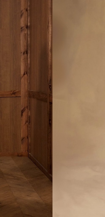 A close-up view of a warm brown wood-paneled wall with visible wood grain and knots, meeting a herringbone parquet floor in the lower left corner. The right half of the image transitions to a soft, blurred sandy beige background.