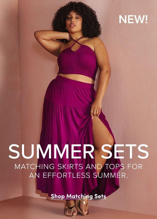 A woman with curly hair models a matching magenta summer set against a pinkish-tan background. She is wearing a halter-style smocked crop top and a tiered maxi skirt with a high leg slit. Bold white text across the center reads "SUMMER SETS," with a sub-caption stating "Matching skirts and tops for an effortless summer." A "Shop Matching Sets" link appears at the bottom.