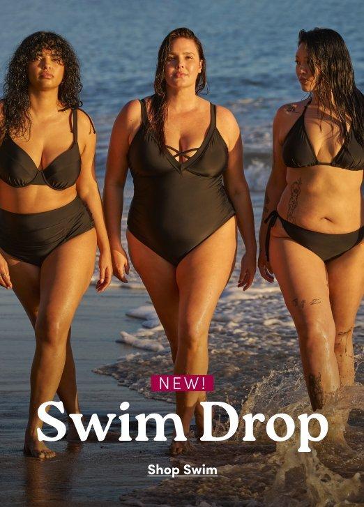 Three women walking along a beach at sunset, modeling different black swimwear styles. The woman on the left wears a high-waisted bikini, the woman in the center wears a one-piece with lattice detailing at the neckline, and the woman on the right wears a string bikini. Large white serif text across the bottom reads "Swim Drop," with a magenta tag above it that says "NEW!" and a "Shop Swim" link below.