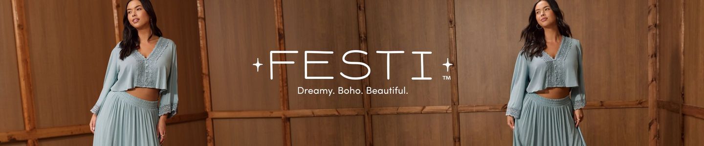 A wide promotional banner set against a warm brown wood-paneled wall background. A woman with long dark hair and gold hoop earrings appears twice in the banner, once on the left and once on the right, both times wearing a dusty teal two-piece set consisting of a cropped long-sleeve V-neck top with crochet lace trim and button front detail, paired with a flowing pleated maxi skirt with a smocked waistband and crochet lace cuffs. Centered in white text reads '+FESTI+' with small four-pointed stars flanking the name and a 'TM' superscript, and below it, 'Dreamy. Boho. Beautiful.''