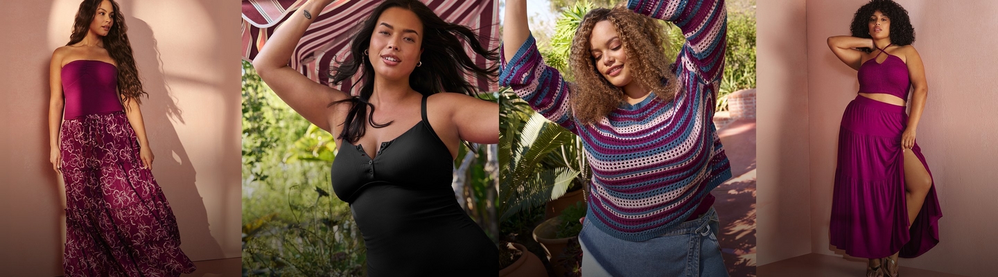 'A wide promotional banner featuring four women modeling outfits against warm pink and outdoor backgrounds. From left to right: a woman with long wavy dark hair stands against a peachy pink wall with soft shadow, wearing a magenta strapless tube top and a dark magenta floral print tiered maxi skirt. The second woman with long dark hair poses outdoors with one arm raised, wearing a black ribbed V-neck camisole top with button detail at the neckline, against a backdrop of lush greenery and a striped awning. The third woman with voluminous curly hair poses with both arms raised outdoors among tropical plants, wearing a blue, pink, and white horizontal stripe open-knit crochet long-sleeve sweater with bell sleeves over medium-wash flared jeans. The fourth woman with short curly hair leans against a blush pink wall with one hand behind her head, wearing a magenta halter crop top with criss-cross straps and a matching magenta satin tiered maxi skirt with a front slit.'