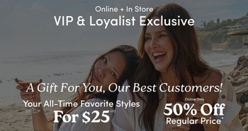 A wide horizontal promotional banner with a darkened beach scene background showing two women sitting close together outdoors. One has long dark hair and holds a drink, leaning her head toward the other. The second has long dark hair and is laughing with her mouth open. Rocky cliffs with greenery and a sandy beach are visible behind them. White text at the top reads 'Online + In Store' and 'VIP & Loyalist Exclusive' in large bold text. Below that in italic script reads 'A Gift For You, Our Best Customers!' On the lower left, text reads 'Your All-Time Favorite Styles' and 'For $25 USD' in large bold text. On the lower right, smaller text reads 'Online Only' above large bold text reading '50% Off' and 'Regular Price*'.