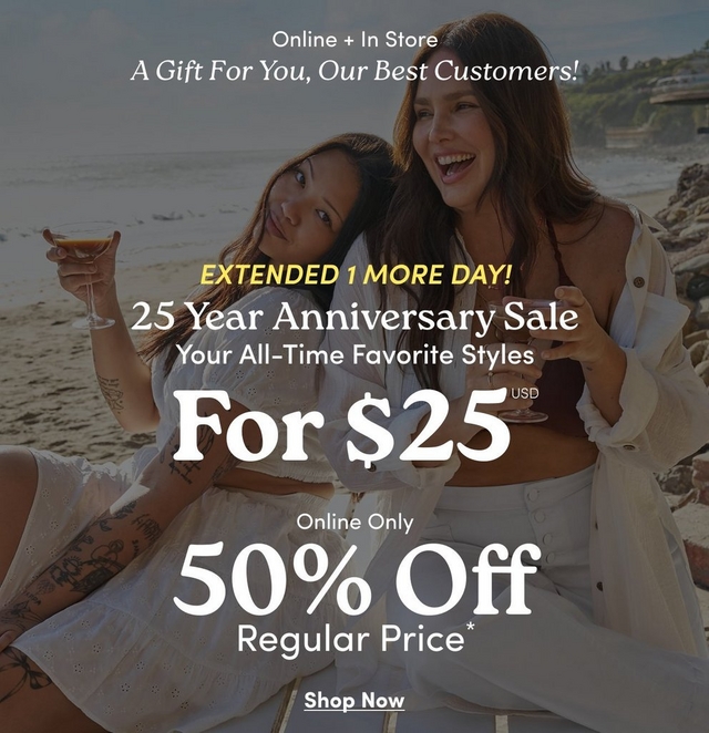 A wide horizontal promotional banner with a darkened beach scene background showing two women sitting together outdoors near the ocean, both with long dark hair wearing white outfits, one laughing and holding a drink. White text on the left reads 'Online + In Store', 'A Gift For You, Our Best Customers!' in italic script, and 'EXTENDED 1 MORE DAY!' in bold yellow text. Centered white text reads '25 Year Anniversary Sale', then side by side: 'Your All-Time Favorite Styles For $25 USD*' on the left and 'Online Only 50% Off Regular Price*' on the right. At the bottom center is underlined white text reading 'Shop Now'.