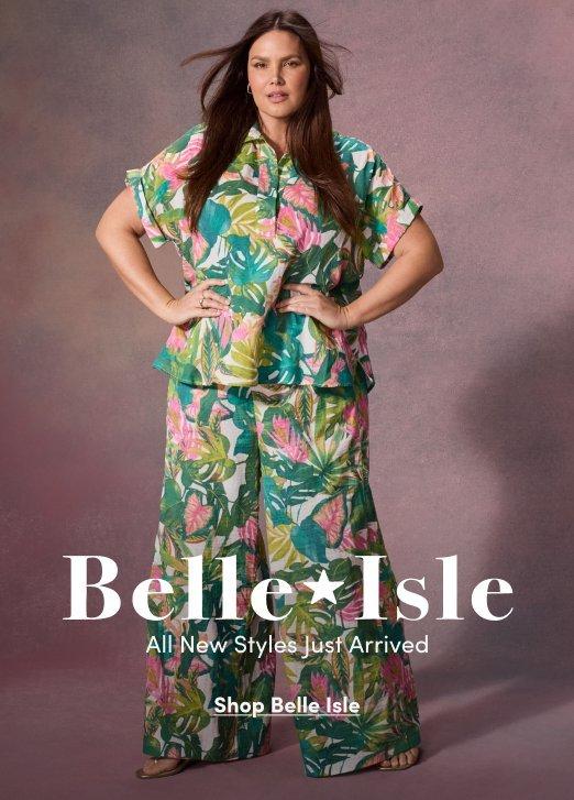 Promotional image for Belle Isle featuring a model wearing a tropical print short-sleeve button-up top with matching wide-leg pants against a mauve background. Text reads “Belle Isle. All New Styles Just Arrived” with “Shop Belle Isle” below.