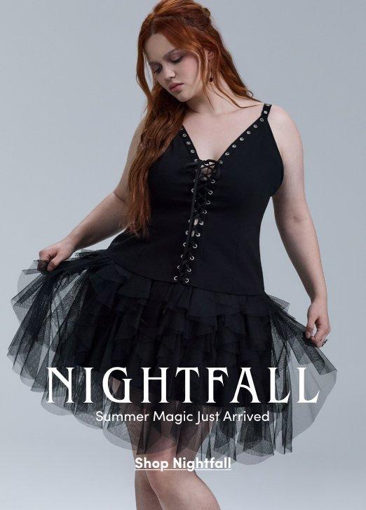 Promotional image for Nightfall featuring a model wearing a black lace-up dress with a layered tulle skirt against a light gray background. Text reads “NIGHTFALL. Summer Magic Just Arrived” with “Shop Nightfall” below.
