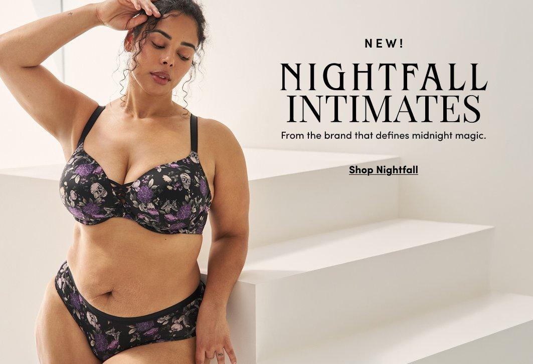 Promotional image featuring a model wearing a black floral bra and matching panties from the Nightfall Intimates collection. Text reads “NEW! Nightfall Intimates” and “From the brand that defines midnight magic” with “Shop Nightfall” below.