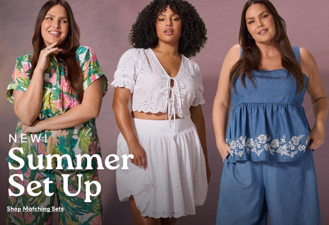 Promotional image featuring three models wearing coordinated summer outfits. One model wears a tropical print matching set, another wears a white eyelet lace tie front crop top with matching skirt, and the third wears a chambray embroidered peplum top with wide leg pants. Text reads “NEW! Summer Set Up” with “Shop Matching Sets” below.